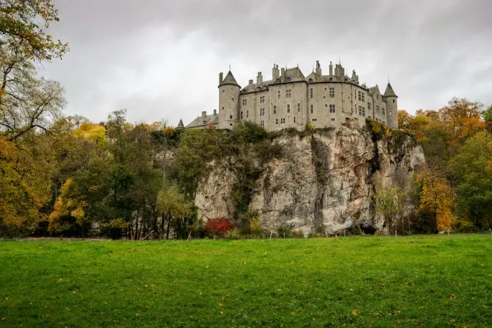 gray concrete castle near green grass field during daytime
